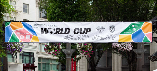 A large banner reading "World Cup Watch Party" on display in downtown Portland