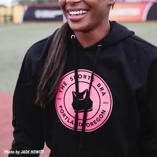 The Sports Bra "Original" Sweatshirt in black and pink worn by AU Pro softball Player with photo by Jade Hewitt Media
